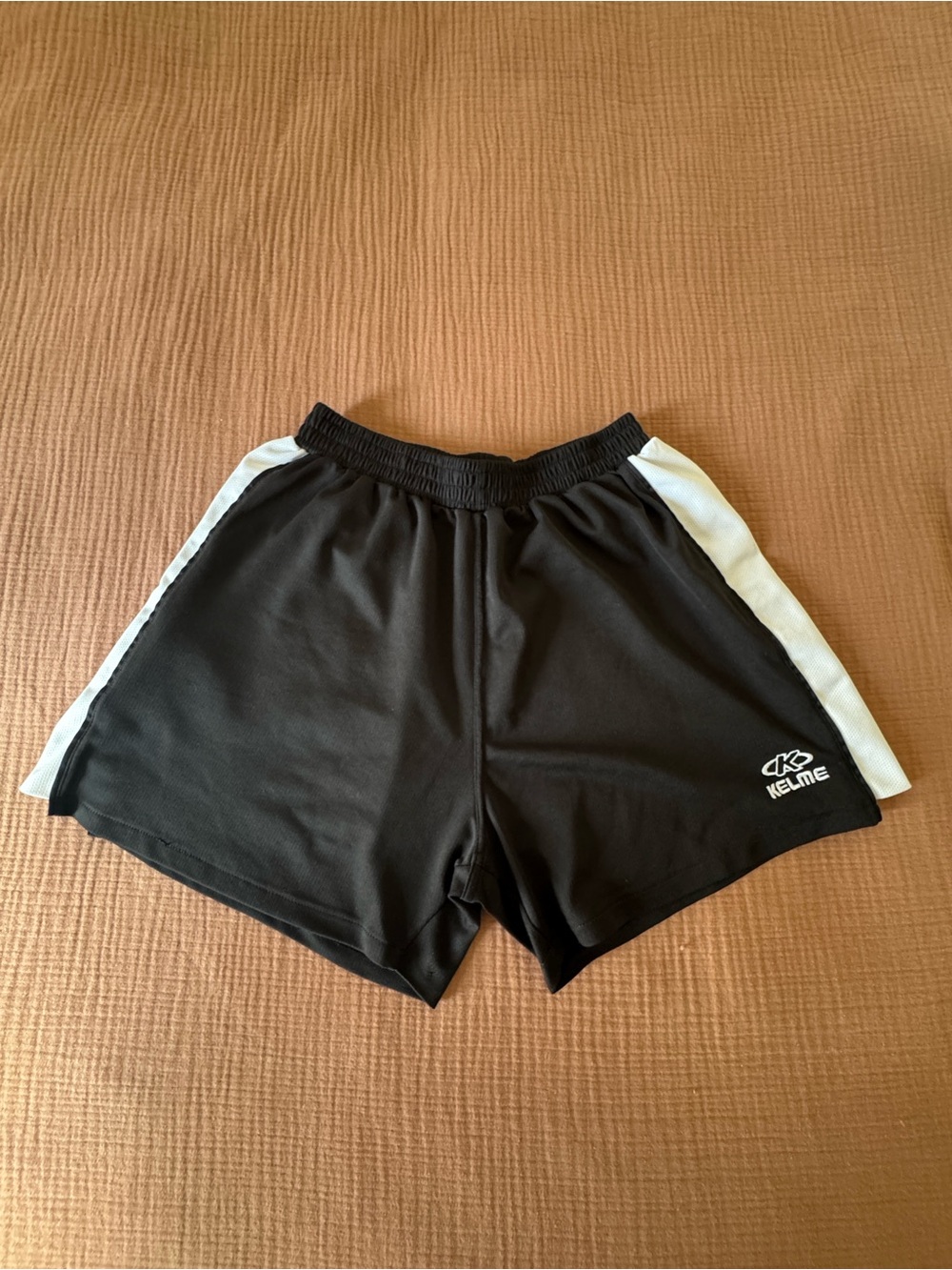 Kelme Black Athletic Shorts with White Side Panels